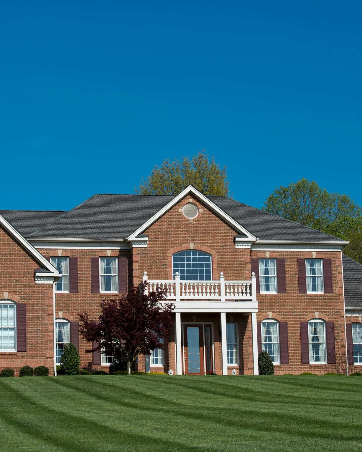 Large brick home representing McCalla residential character