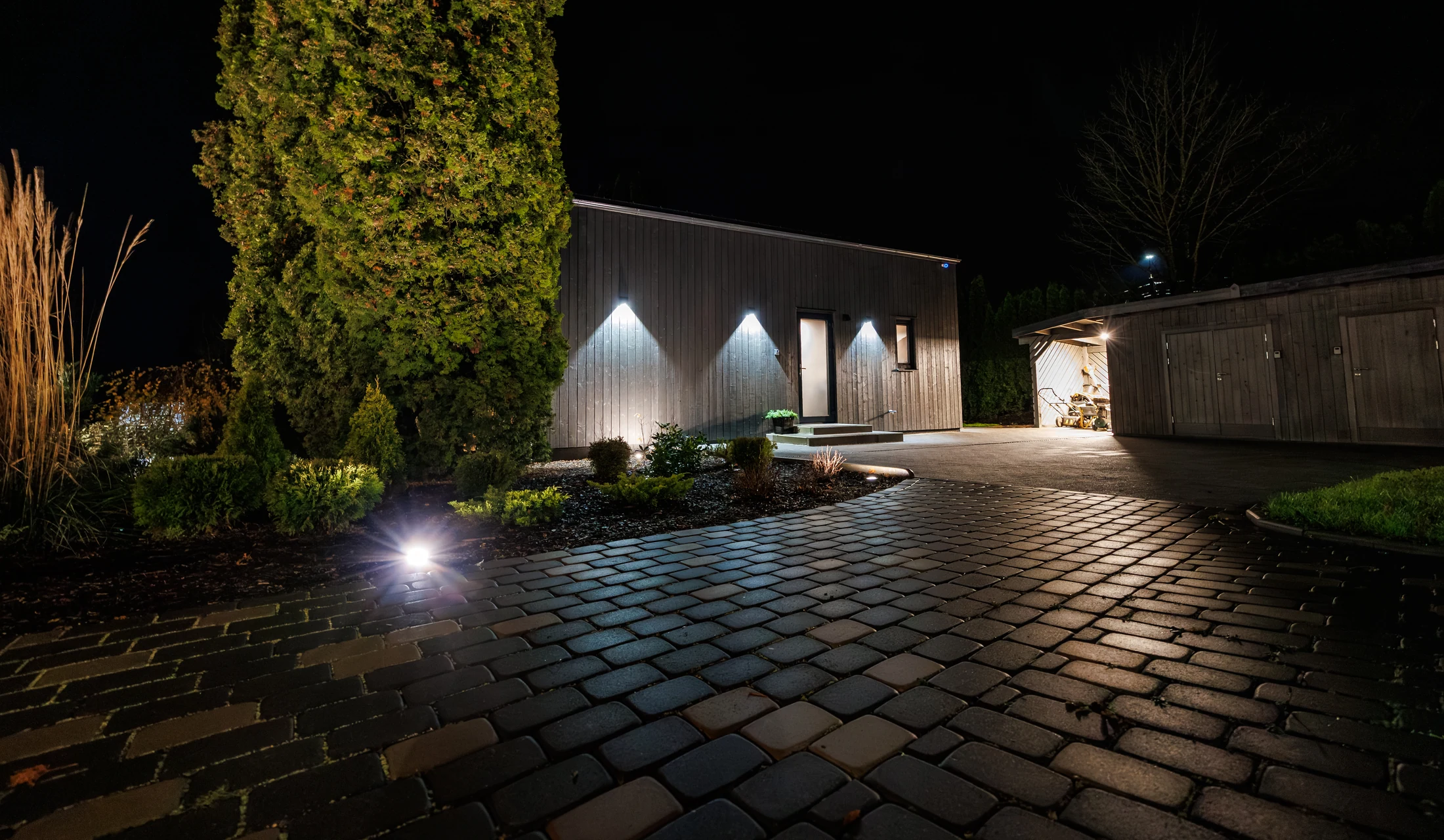 Modern residence illuminated at night